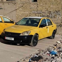 لانسر ٢٠١٠  مكينه وكير  ٢٠٠٠ جديده  مصارلها ١٥ شادها رقم بغداد انكليزي...