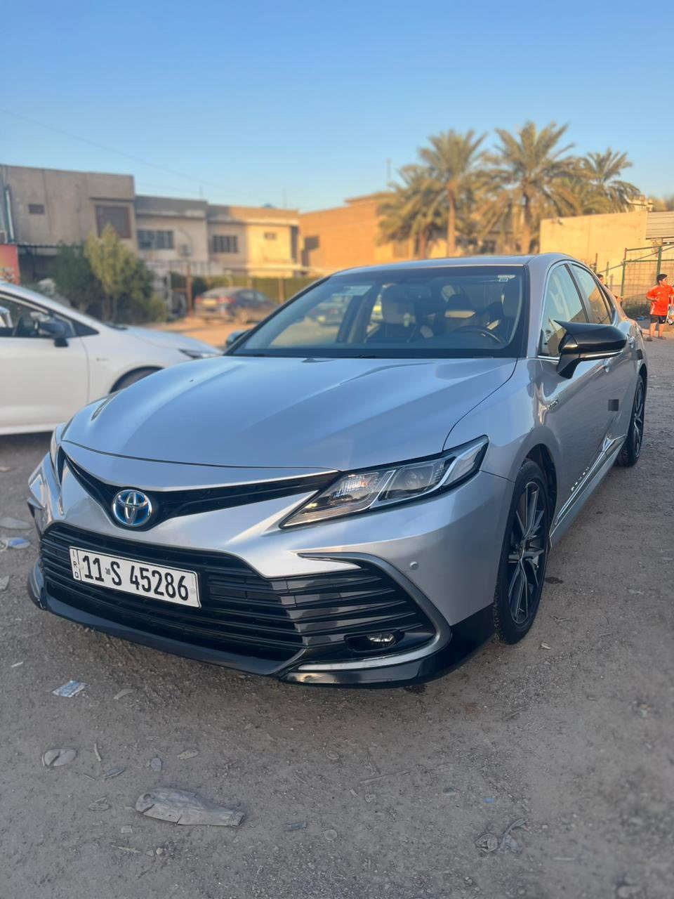 السلام عليكم للبيع كامري هايبرد موديل 2023 فول مواصفات وارد خليجي GLE عبداللطيف جميل لون رصاصي غير محدد سيارة كفالة عامة وجديدة
مواصفات السيارة 
1- فتحة سقف
2-تبريد قطعتين
3-بردة خلفية اوتو
4-هاند بريك بصمة
5-نظام اوتو هولد للازدحام
6-ثلاث وضعيات قيادة
-اقتصادي -وعادي -وسبورت
7-شاشة كبيرة
8-حساسات امامية وخلفية
9-مري جانية شفط
10-دخول ذكي(بصمة)
11-كاميرا خلفية
12-زجاج الابواب اوتو
13-تعتيم اللكتروني للمراية الوسطية
14-تحكمات ستيرن
15- صندوق بصمة
16-ويل كب رياضي حجم 18

العنوان بغداد / حي القاهرة  والسيارة بأسمي 
السعر 240$ وبيها مجال
رقم الهاتف ***********
