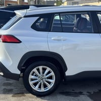 كورلا كروز 2024 ماشية 10 الاف  اخذتها زيرو السيارة بسمي  مكفولة كفالة ...