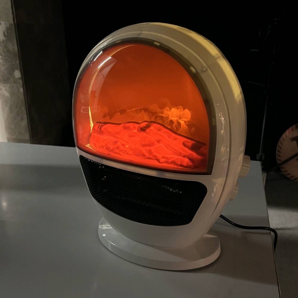� مدفأة فاخرة بتصميم لهب واقعي – دفا وجو بنفس الوقت! 🔥

حوّل برودة الشتاء إلى دفء مريح مع هذه المدفأة الأنيقة ذات التصميم العصري الشبيه بالكبسولة الفضائية.
تجمع بين حرارة قوية وإضاءة لهب ثلاثية الأبعاد تمنح المكان لمسة دافئة وفاخرة.

✨ المميزات:
	•	🔥 تأثير لهب واقعي يخلق أجواء مريحة وساحرة في أي غرفة.
	•	💨 تسخين سريع بفضل شبكة التدفئة الأمامية عالية الأداء.
	•	🔇 هادئة جدًا – مناسبة لغرف النوم والمكاتب.
	•	⚡ استهلاك منخفض للطاقة مقارنة بالمدافئ التقليدية.
	•	🔒 آمنة ومزودة بقاعدة ثابتة تمنع الانزلاق ومؤشر تحذير.
	•	🎨 تصميم أنيق يضيف لمسة ديكور حديثة لأي مساحة.

💡 مثالية لـ: غرف النوم – الصالات – المكاتب – الكافيهات – الديكور الشتوي.

✨ دفا… وذوق… ونور لهب يخلي الجو أحلى