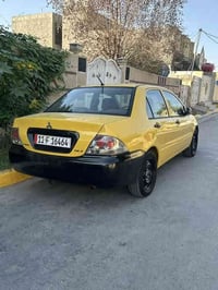 لانسر 2010 مصفرهه هيه وغرامات بسمي تحويل ثاني يوم   رقم إنكليزي شادهه ...