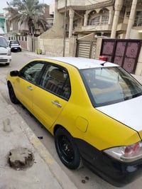 سيارة لانسر (2011)بغداد/اجرة،محرك(2000/اوتوماتيك),تدفئه+تبريد ،محرك لا...