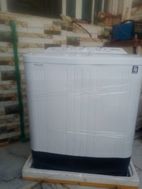 غسالة ملابس • جديدة بلكارتون • ١٨ ونص كيلو