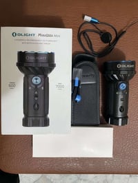 كشاف Olight • ٧٠٠٠ لومن • مدى ٦٠٠م