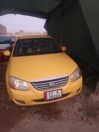كيا سبكترا امريكي  مكينه 20 كير عادي  75وبيها مجال رقم الهاتف 07771775...