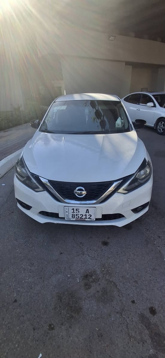🚗 نيسان سنترا SR موديل 2018 للبيع 🚗
​نوع السيارة: نيسان سنترا (فئة SR السبورت).
​الموديل: 2018.
​اللون: أبيض صدفي مميز.
​ (الضرر): قطعتين فقط (بنيد وجاملغ)، وباقي التفاصيل حسب تقرير الفحص.
​المواصفات:
​مظهر رياضي (فئة SR) مع جناح (سبويلر) خلفي بلون أسود بلادي.
​ويل تراك  سبورت بلون أسود مميز.
​السيارة بحالة جاهزة ونظيفة جداً كما موضح بالصور.
​📍 مكان الانبار الرمادي الخالديه 
​السعر المطلوب: 115 ورقة وبيه مجال قليل للشراي 
​ / 
 والاستفسار: يرجى الاتصال على الرقم: 📞 ***********
