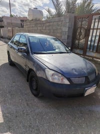 لانسر ٢٠١٠ • ميكانيك زين • رقم ديالى