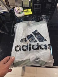 نعل BOOST خفيف • تمويه رقمي • مواد معاد تدويرها