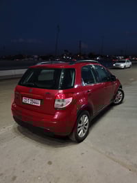 ‏سوزوكي SX4 موديل 2014 ياباني 🇯🇵اصلي ( خليجي )‏ لون احمر🍅 .. رقم بغداد...