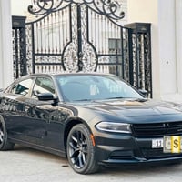دوج چارجر ٢٠٢٢ اسود sxt  مواصفات عاديه وارد أمريكي تقرير غرق تعمل وتسي...