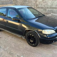 اوبل استره 2002صدامي  بلاديه بدون صبغ كير محرك كهربايات جاهزه  شرط الت...