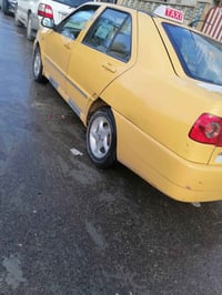 كوين 2011 رقم بغداد احمر  مكينه وكير شرط كابون بانزين  الهيئه عل مشتري...