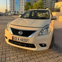 نیسان سەنی لاکشمیبای 2014.تەکسی یەک پارچە ڕەشە چاملغی لای سایەق پێشەوە...