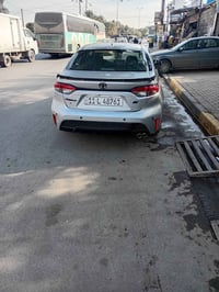 كورلا ٢٠٢٢ ماشيه ٤٢الف السعر ١٣٣ورقه بيها اربع قطع السونار والحادث مرف...