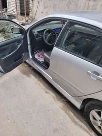 كورلا 2008  مكفوله كير و مكينه و كشر شاشه و كامره 100$ 07843199131