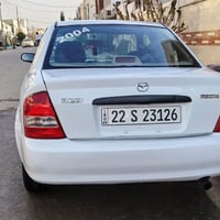 مازدا 323 • ٢٠٠٤ • ترخيص ٢٠٣١