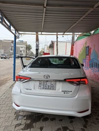 كورلا هايبرد موديل 25 علامه سوده رقم بغداد ماشية 22 الف سياره فول مواص...