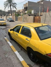 لانسر مديل 2010 السيارة بسمي رقم بغداد  للاتصال 07701610103