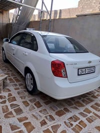 اوبترا 2013 رقم انكليزي نظافة فول بيها قطعة صبغ الباب الخلفي والباقي ش...