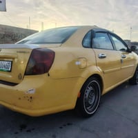 اوبترا 2011 اللون اصفر بلادي وبيه ضربه جاملغ امامي  ومصبوغه حزام للجما...