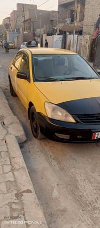سياره لانسر ٢٠٠٩رقم بغداد مصفره هيه  جاملغ الأمامي اليمنى مصبوغ مكاني ...