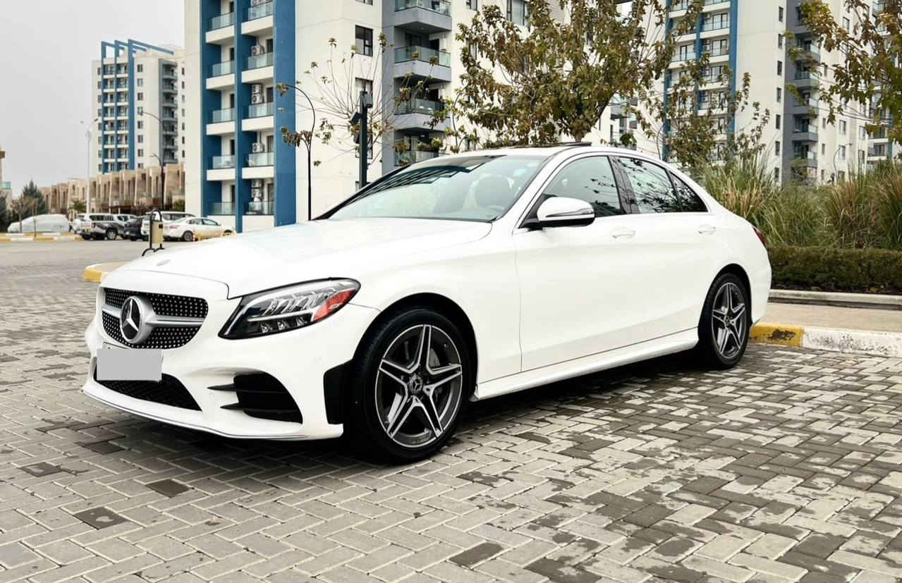 السعر مناسب جداً قياساً بالجدادة والنظافة استخدام شخصي
Mercedes Benz C300 AMG موديل 2020 
عداد المسافة: 50 ألف
رقم السيارة: أربيل تحويل بشرط

ال💎ــسعـر 🟥 :: رقم (1) تلـقـائـي 📮

مواصفات وتفاصيل السيارة:
فتحة سقف (سلايد روف)
المحرك: 2.0 لتر توربو – 4 سلندر
ناقل حركة 9 نمر
شاشة معلومات وسطية بحجم كبير

تحكمات كاملة على الستيرن
نظام ملاحة (Navigation) + CarPlay
حساسات أمامية وخلفية + كاميرا خلفية
مقاعد جلد أسود ودشبول مطعم بالصاج

نظام تثبيت سرعة مع رادارات أمامية 
وخلفية وجوانب تشغيل بصمة 
مع نظام دخول ذكي لجميع الأبواب

تدفئة ستيرن + أنارة محيطية (64 لون)
بصمة أبواب مع بصمة فتح وغلق الجنطة
كشنات أمامية تدفئة مع نظام خزن (ميموري)

كشنات أمامية كهربائية
صندوق كهرباء + 5 أنظمة قيادة
لايتات ليد (8 عدسات) + بك لايت ليد

شحن وايرلس (Auto)
سستم سماعات Burmester
نظام Auto Stop + Auto Hold
هيكل AMG بلادي شركة

ويل كب حجم 18 مع تخم تايرات دنلوب لوك
عدة الإسعافات، الهوك، الجنطة، 
واللوحة موجودات

السيارة حادثة حادث سطحي: 
جاملغ أمامي أيمن ربعه مبدل ومبخوخ، 
مع جاملغ خلفي أيمن وشوية من الباب الخلفي 
مسوي مباوك فقط، بدون تعديل بارد، 
بدون شخوط، وبدون أي إيرباك 

(كلها سليمة على وضع شركة)
السيارة مسويلها بوليش وتشميع

السيارة بدون أي خلل، كير ومحرك وحدادية بشرط والكهربائيات شغالة، ومسويلها سيرفس دهن وفلاتر ومي راديتر (أنتي فريز) وبدون أي نقص 
موقع السيارة بغداد حاليا

رقم صاحب ســـيـارة :: ***********
