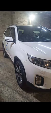 سياره سورنتو فول واحد على واحد داخل قرميدي موديل ٢٠١٤ بدون ضر رقم نينو...