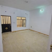شقة أرضية • ٢ غرف • بطريق بغداد