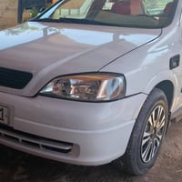 اوبل استرا موديل 2002سياره بلاديه مابيها صبغ شبر بالجاملغ الامامي فقط ...