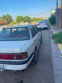 مازدا 323 • مازدا 1990 • سيارة مازدا • كير عادي • تبريد شغال • محرك مج...