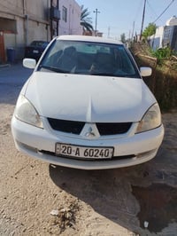 لانسر ٢٠٠٩ • ١٥٠٠ • اوتوماتيك