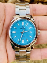 ساعة يد • أوتوماتيكية • مينا فيروزي