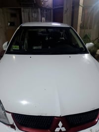 لانسر موديل ٢٠١٠ مكفوله كفاله عامه بيه بارد قليل مكينه ١٥٠٠ قبق ابيض ٨...