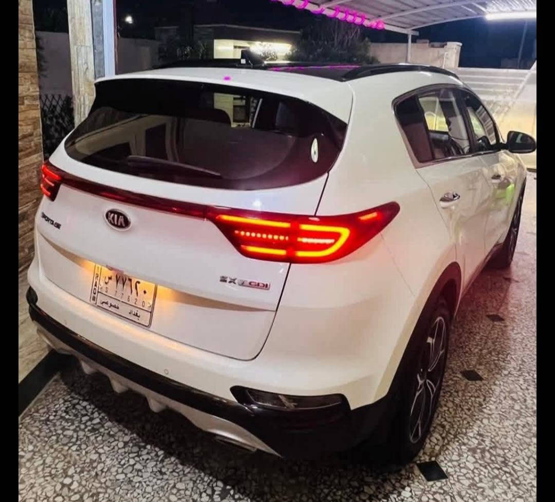 ‏Kia Sportage SXL 2000 Turbo 2021   سبورتج 2021 وارد امريكي لون ابيض رقم بغداد حرة باسمي  السيارة اني مستوردها ع ايدي حادثها تبديل جاملغ وبنيد ايرباك ستيرن فقط ماشية تقريبا 83 الف ميل السيارة فووووول مواصفات 1/1 فئة SXL    مواصفاتها  محرك 2000 تيربو دبل كزوز   / سقف بانوراما قطعتين / بصمه ابواب و تشغيل و صندوق / ستيرن حرف دي تحكم ستيرن كامل / تبريد امامي خلفي / شحن لاسلكي / كشنات جلد لونين كريمي واسود + الاماميات كهرباء تدفئة وتبريد / تدفئة استيرن / انارة داخلية لد / رادار امامي + جانبي مرآة + خلفي  / لايتات زينون عالي ناصي + بك لايت لد / سيتم سماعات 10 سماعة هارمن كاردن صوت مرعب  / سايد بريك كهربائي (بصمه) / اوتو هولد / شفتات ستيرن / شاشة كبيرة بلادية / اشاير مرايات جانبية + شفط  /ويل 19 بلادي كروم / رادار خروج عن المسار  ...  وبعد هواي بيها مواصفات    رايدها غير متواجد ع الفيس للاستفسار الاتصال ***********
