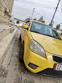 كيه ريو موديل 2010 وارد امريكي  ضررها بديه الشاصي محرك وكير شرط هيئه و...