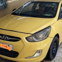 آكسنت مضلع تكسي رقم نينوئ الإنكليزي بيها مضومة غاز كير ومحرك شرط.........