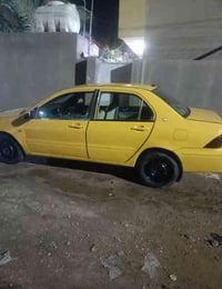 مسيو بوشي لانسر2003 رقم بغداد مكينة وكير كورلا سيارة عوزة ترتيبات بسيط...