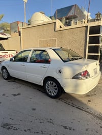 لانسر ٢٠١١ • ماتور 1500 • رقم بغداد جديد