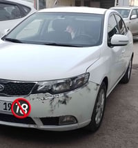 عندي كيا سيراتو خليجي  موديل ٢٠١٢ رقم بغداد بأسمي سيارة نظيفة ماشية ١٤...