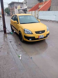 كيا ريو هاش باك 2009  سياره كدام عينك سياره مال بيت  مصبوغه جديد ومكين...