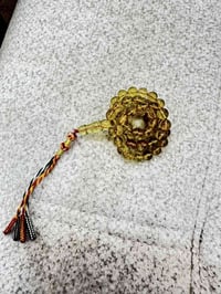 مسباح كهرمان طبيعي • عسلي شفاف • ٣٠غ ٦٣حبة