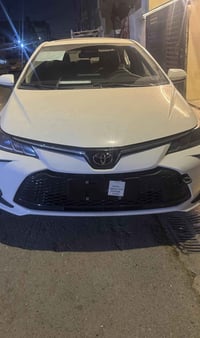 كورولا هايبرد 2025 مرقم بغداد سيارة نظيفة وجاهزة، شكل خليجي مع كفالة ع...