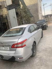 السلام السلام  عليكم نيسان سنترا 2015 رقم شبه مميز بغداد باسمي السياره...