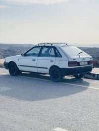 مازدا 323 سياره باسمي هزه جديده كابون بانزين محرك كير شرط ترايلك وين م...