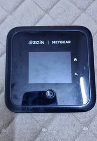 راوتر نت گير M5 شغال طبيعي لكل الخطوط واي فاي6 شاشة لمس نقص بطارية وقب...