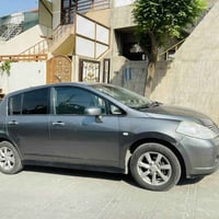 نيسان تيدا • ٢٠٠٧ • اصفر