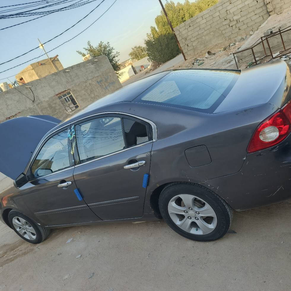 ‏سلام عليكم 
‏كيا اوبتيما /Kia Optima 🚗
‏مديل 2007 وارد امريكي سياره مصبوغه حزام 
‏ضررهاا جاملغ الخلفي بشرط لا حوضل ولا تكمله ولجاملغ الخلفي الثاني بيه بارد موضع بل صور فقطط بجم كبس ما ملعوب بيه  القماره بيها طلقات ثنين بس وجه القماره فقط 
‏السياره كلها ليبل واحد مابيها ولا  قطعه تبديل 
‏مكينه كير حداديه تخم تاير كله عشرط ومكفول مكينه لا تنقيص ولا بخار ولا دوانز 
‏ تبريد ثلج منضومه جديده 
‏كهربائيات كله شغال
‏  ABS1
‏2 تحكم ستيرين جهتين شغال
‏3شاشه تاب تدعم نضام اندرويد اوتو +ابل كار بلي 
‏4شاشه +كامره 
‏5دوشمه جديده غرفه السياره اتخبل 
‏6مثبت سرعه 
‏السياره حلوه ما متعوبه 
‏بسمي سنويه لل٢٠٢٨  رقم بغداد  بسمي شخصياا
‏سعرهاا  ٩٠ وبيها مجال لشراي يشلع عيوني 
‏مكانها نجف طريق كربله نجف عامود ٣٦٦
‏رقمي ***********/***********
‏واني خادم النجف, العراق

