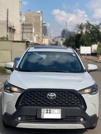 كورلا كروس  هايبرد 2024 ماشيه 6 الالف بحالة الزيرو رقم بغداد بأسمي علي...