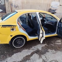 متوفر افيو كوري تكسي  2009رقم بغداد  سنوية وهزة 2027 شرط تحويل كابون ب...