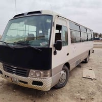 كوستر كاز ٢٠٠٢ رقم بغداد إنكليزي مصفرة  محرك كير أكسل كفالة  تبريد شغا...